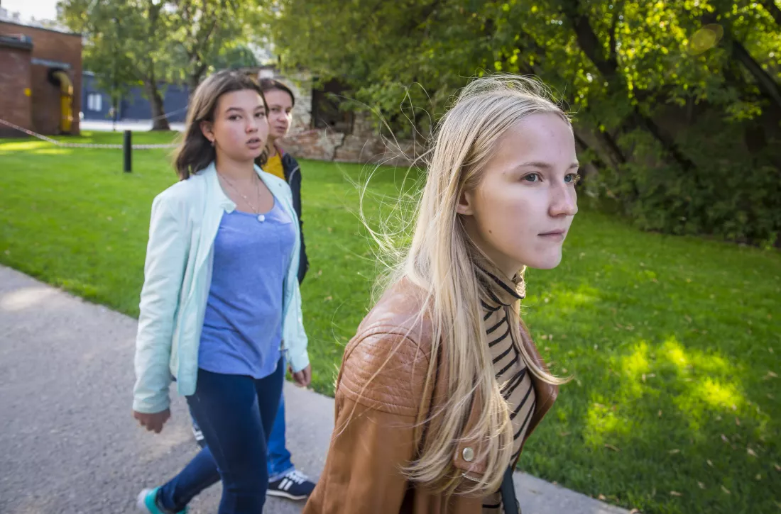 teenage-girls-walking-footpath